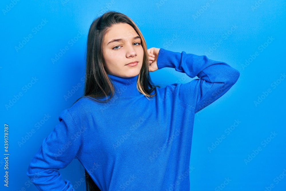Young brunette girl wearing turtleneck sweater stretching back, tired and relaxed, sleepy and yawning for early morning Young brunette girl wearing turtleneck sweater stretching back, tired and relaxed, sleepy and yawning for early morning