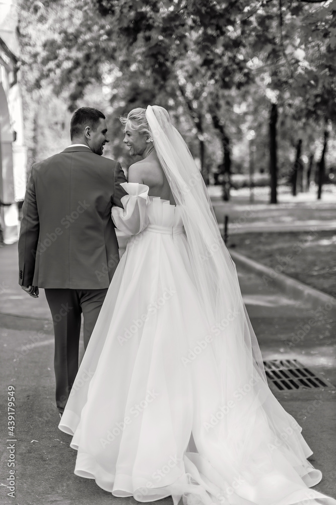 the groom and the bride walk in the park the groom and the bride walk in the park