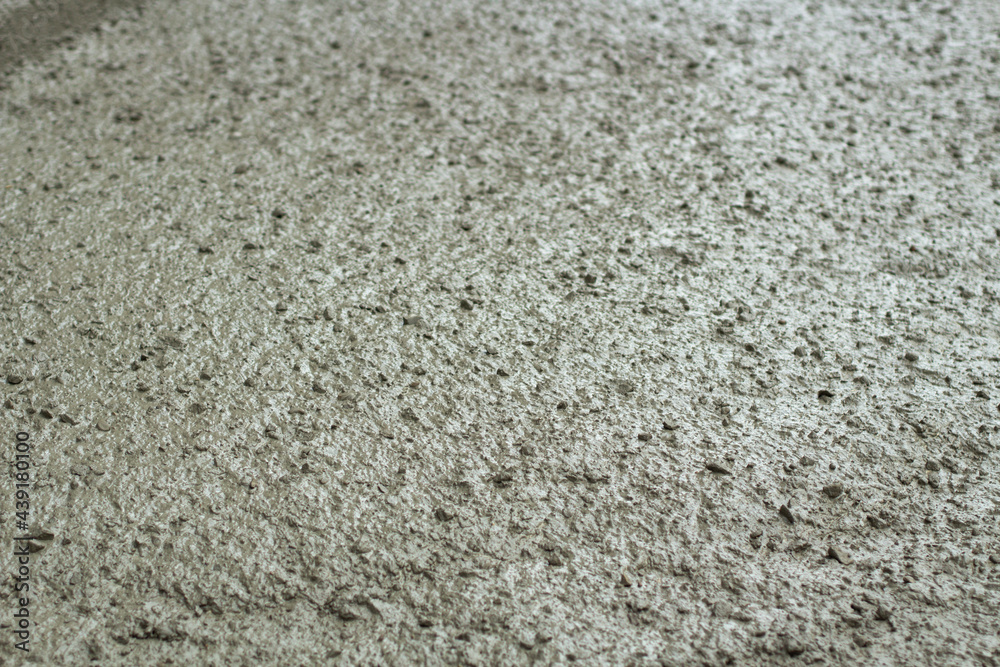 Liquid cement at a construction site. Cement spilled onto the road.