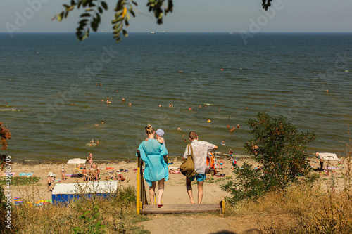 RUSSIA, YEYSK - 20 August 2016: Wooden stairs to the Kamenka beach with people. Russia, Sea of Azov, Krasnodar Territory, Yeysk.