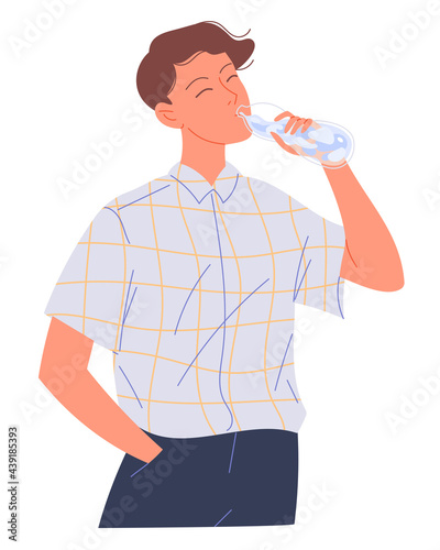 Young man drinks water from a bottle