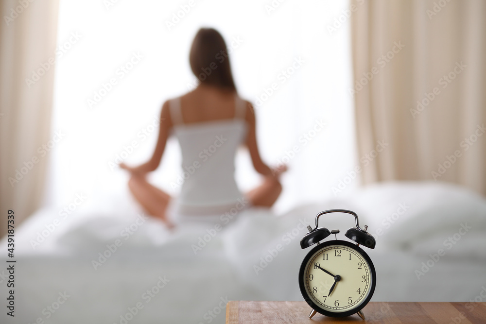 Woman stretching in bed after wake up, back view, entering a day happy and relaxed after good night sleep. Sweet dreams, good morning, new day, weekend, holidays concept Woman stretching in bed after wake up, back view, entering a day happy and relaxed after good night sleep. Sweet dreams, good morning, new day, weekend, holidays concept
