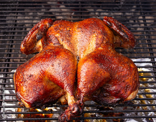 grilled whole spatchcock chicken on grill