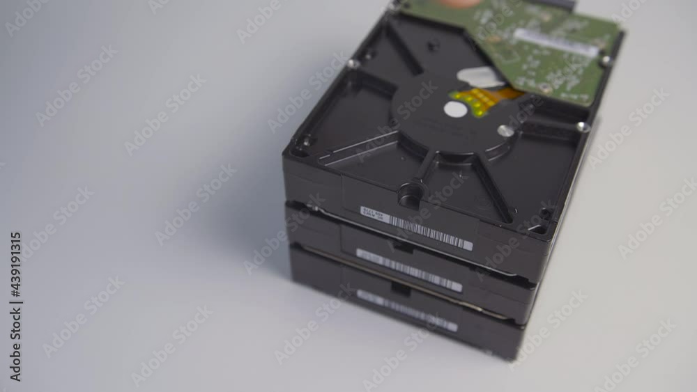 Person removes hard disk drive.