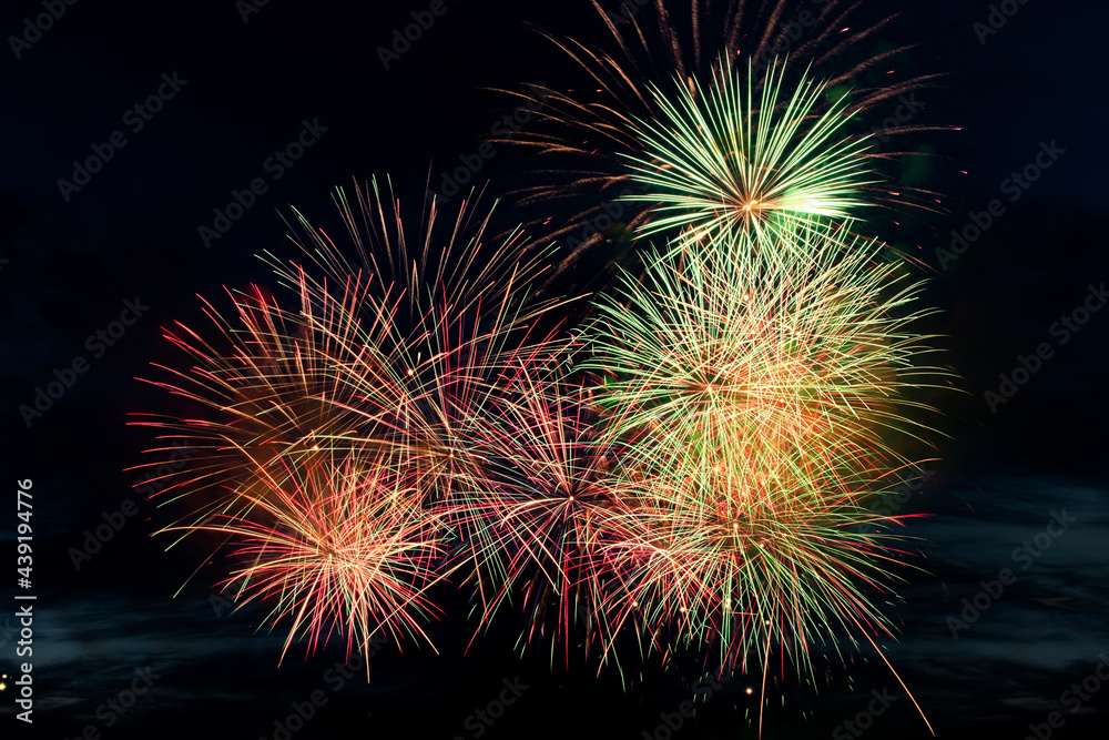 Colorful fireworks on black background. Celebration and holidays concept. Independence Day 4th of July, New Year, festival. Bright explosions of lights in sky.