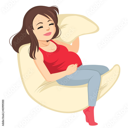 Beautiful young pregnant woman sleeping on moon shaped sleeping pillow