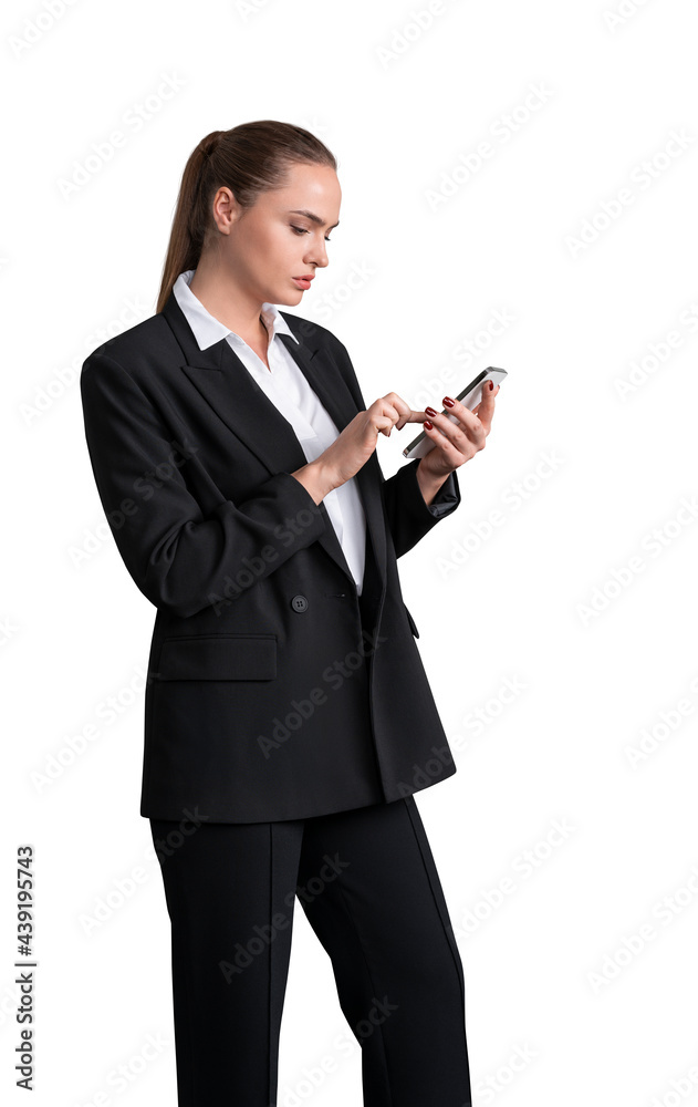 Side view of young attractive business woman in black suit with white shirt holding smartphone and browsing the internet, isolated on white background Side view of young attractive business woman in black suit with white shirt holding smartphone and browsing the internet, isolated on white background