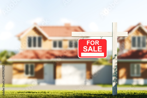 Fotografie Houses for sale, red sign in front of blurred modern big building on grass