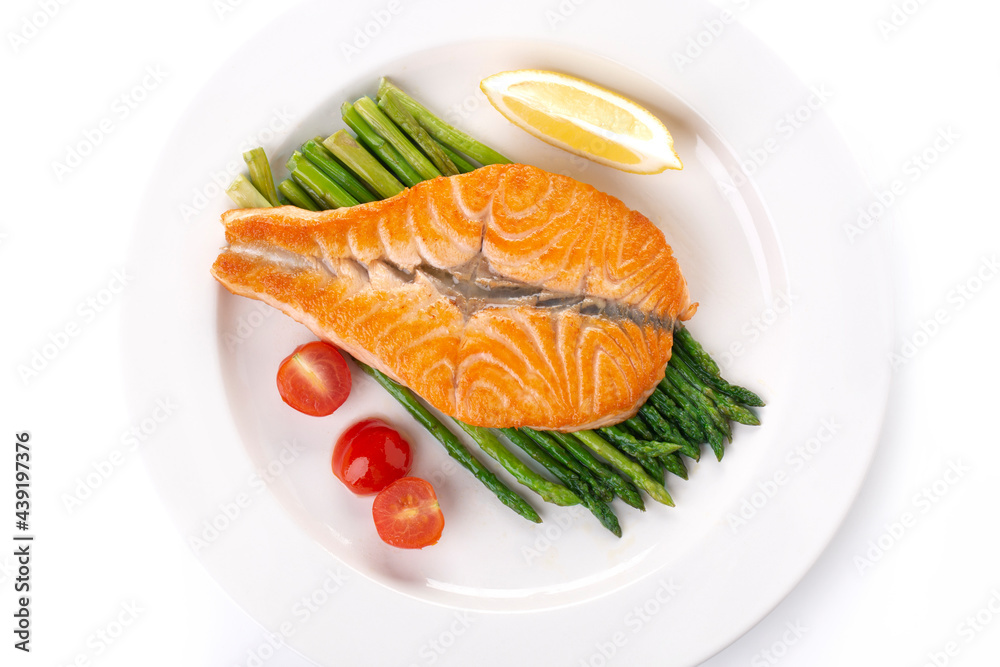 Grilled salmon butterfly and asparagus on a white plate Grilled salmon butterfly and asparagus on a white plate