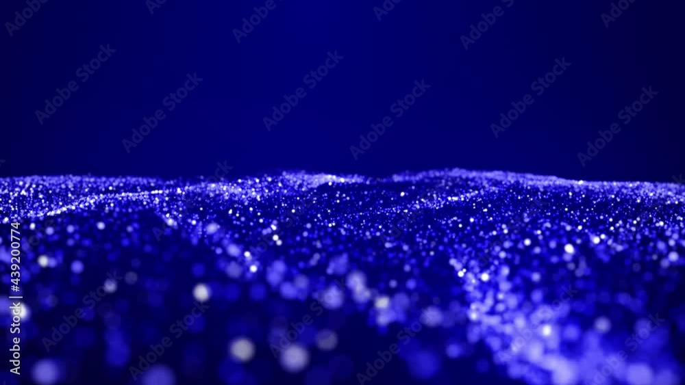 Abstract bg with blue magic glitters fly in air in slow motion and form beautiful swirls. Sparkles float in viscous liquid. As alpha channel use luma matte. Sparkles in flow of turbulence forces