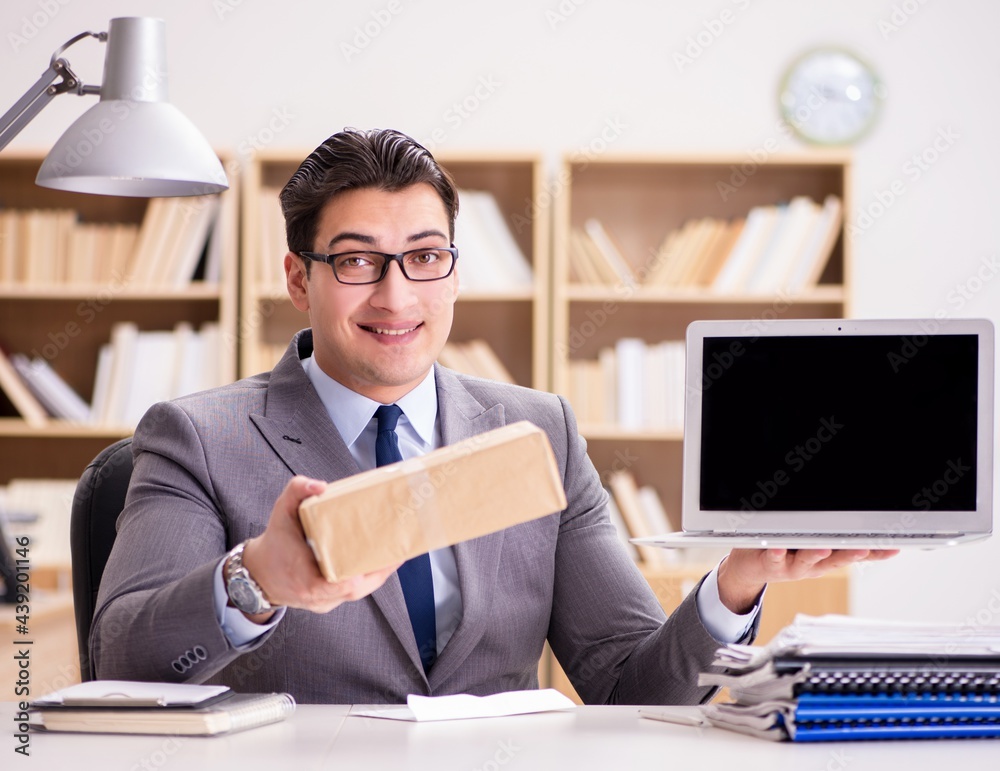 Businessman receiving parcel in the office Businessman receiving parcel in the office