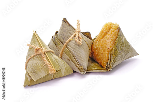 Sticky rice dumpling or Zongzi (Pyramid-shaped dumpling made by wrapping glutinious rice in bamboo leaves) for Chinese Boat dragon festival (5th Lunar month festvial. Isolated on white background. photo