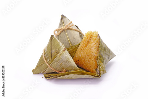 Sticky rice dumpling or Zongzi (Pyramid-shaped dumpling made by wrapping glutinious rice in bamboo leaves) for Chinese Boat dragon festival (5th Lunar month festvial. Isolated on white background. photo