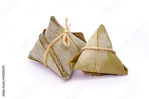 Sticky rice dumpling or Zongzi (Pyramid-shaped dumpling made by wrapping glutinious rice in bamboo leaves) for Chinese Boat dragon festival (5th Lunar month festvial. Isolated on white background. photo