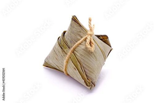 Sticky rice dumpling or Zongzi (Pyramid-shaped dumpling made by wrapping glutinious rice in bamboo leaves) for Chinese Boat dragon festival (5th Lunar month festvial. Isolated on white background. photo