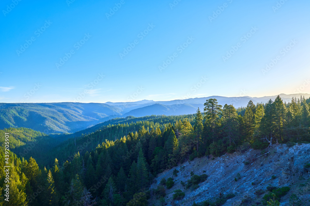 Scenic View of Northern California mountains at sunrise with blue skies 