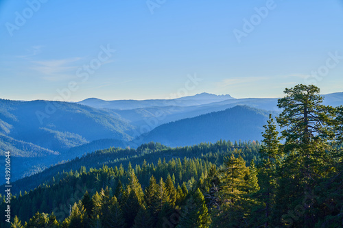 Northern California Mountains in the early morning with blue skies and morning Fog