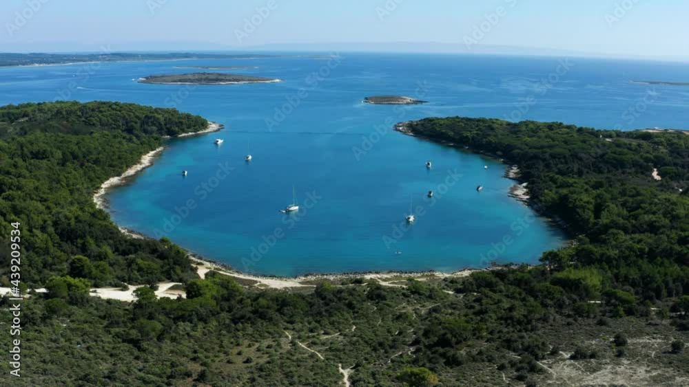 Picturesque View Of Croatian Beach With Yachts At Cape Kamenjak National Park Near Pula In Istria, Croatia. - Aerial Drone Shot Picturesque View Of Croatian Beach With Yachts At Cape Kamenjak National Park Near Pula In Istria, Croatia. - Aerial Drone Shot