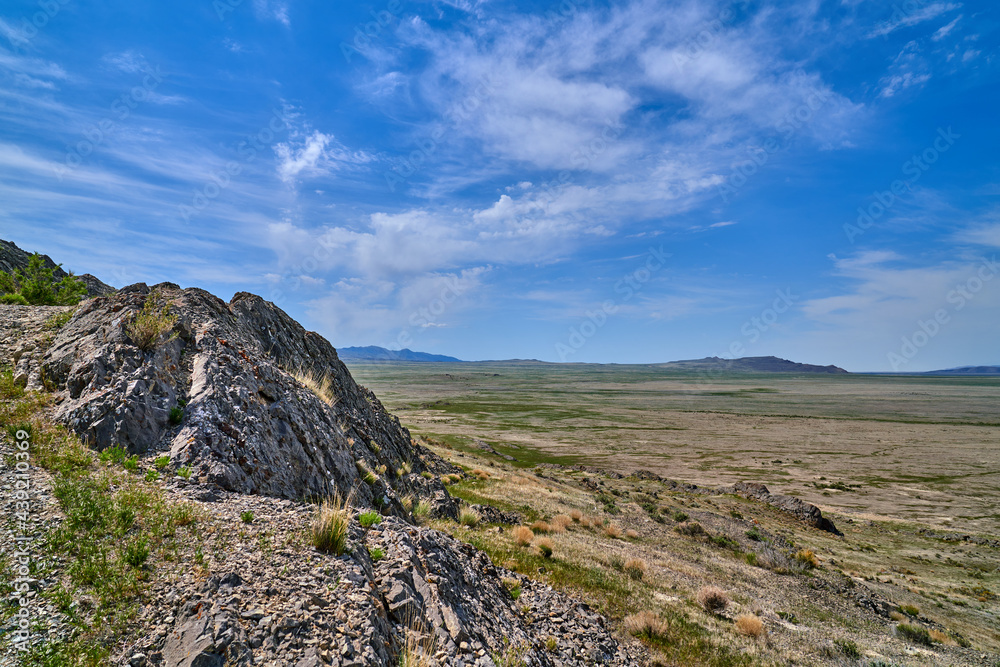 Scenic View of Utah Desert Mountain Rocky landscape with blue skies and white clouds