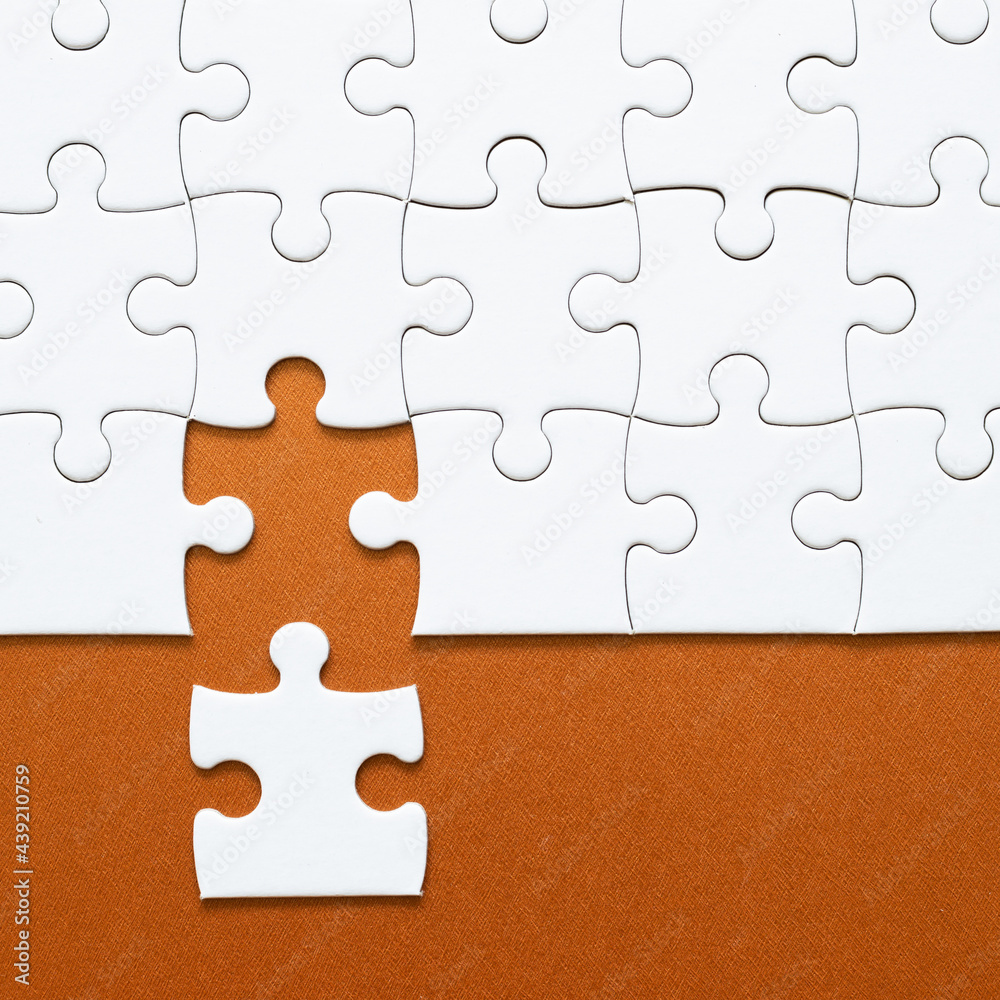 Fototapeta premium Set of white puzzle pieces and last one piece