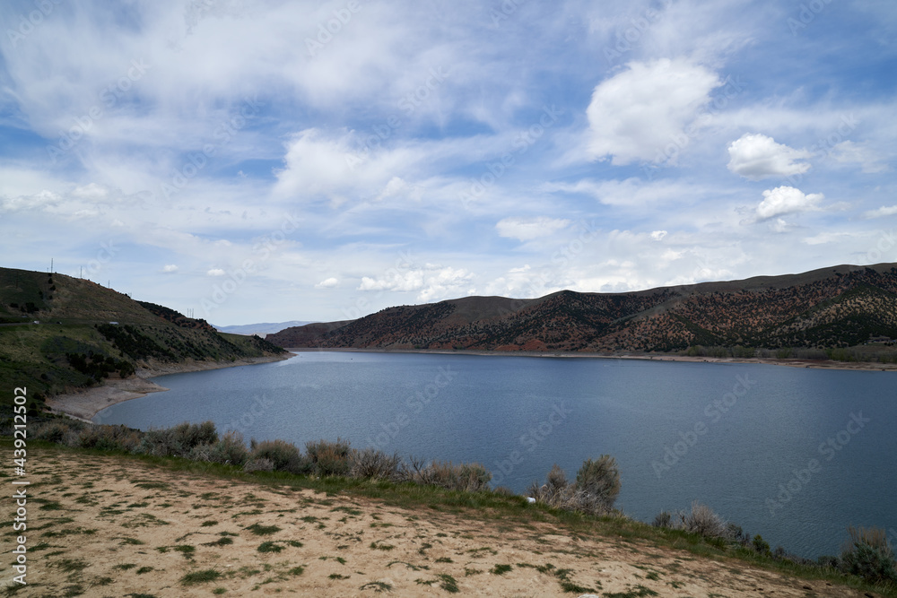 Scenic View of California Lake in the mountains in summer with blue skies and puffy white clouds