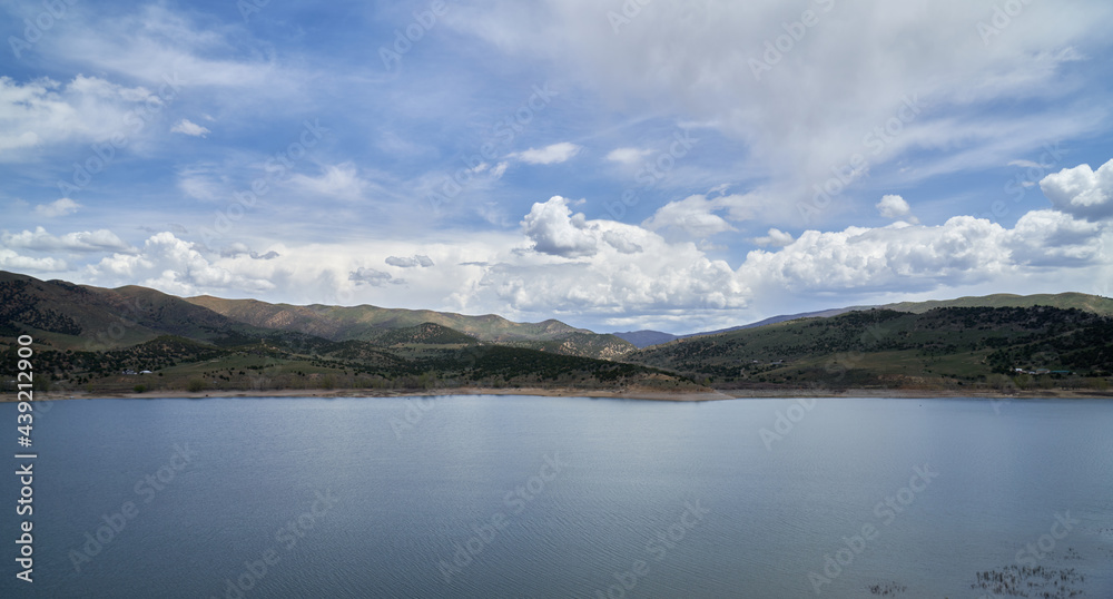 Scenic view of California Lake in the mountains in summer with blue skies and puffy white clouds