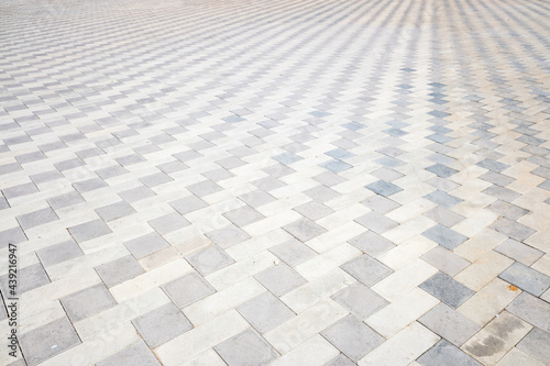 Gray paving stones  street tiles background.