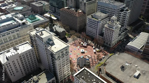 Cinematic aerial drone footage of the Pioneer Courthouse Square downtown Portland near Pearl and Lloyd Districts, Nob Hill, Buckman Neighborhood, King's Heights, skyscrapers and cityscape in Oregon photo