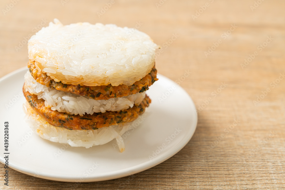 grilled spicy pork and herbs with  sticky rice burger