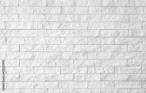 White grey brick wall background light patterns with space