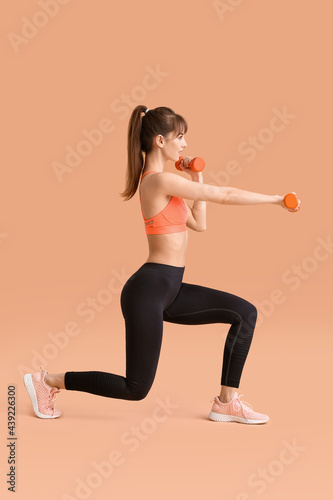 Sporty young woman training...