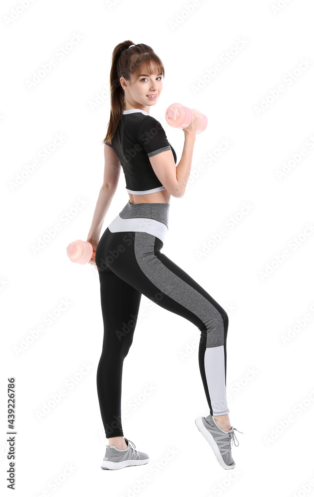 Sporty young woman with dumbbells on white background Sporty young woman with dumbbells on white background