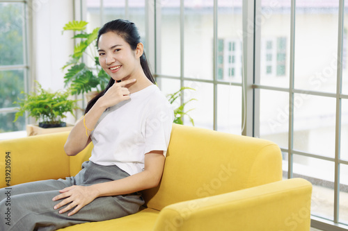 Young and beautiful Asain woman sitting and demonstrat and communicate with hand sign, deaf language. Free Download Young and beautiful Asain woman sitting and demonstrat and communicate with hand sign, deaf language. - GFXLoad