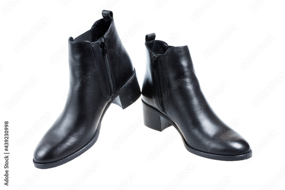 Pair of ladies fashion black leather heeled boots, on white background Pair of ladies fashion black leather heeled boots, on white background