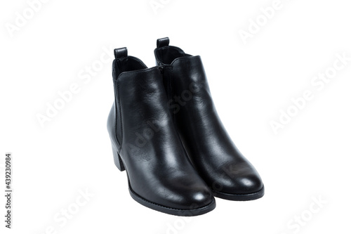 A pair of beautiful black leather ladies boots, on white background