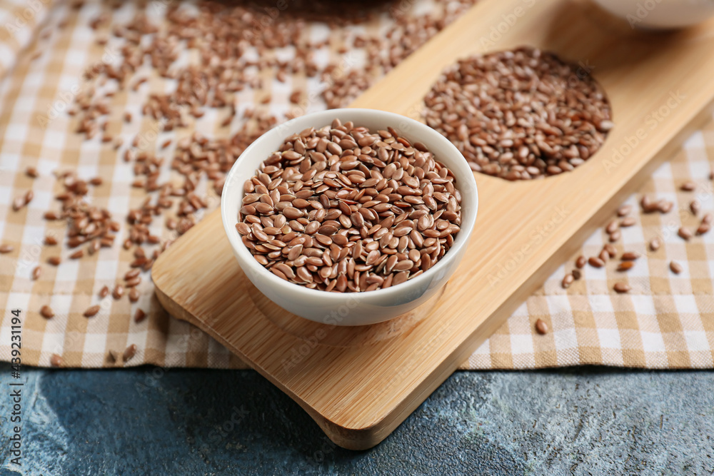 Bowl of flax seeds on color background, closeup Bowl of flax seeds on color background, closeup