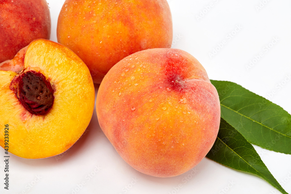 Fresh peaches and leaves Fresh peaches and leaves