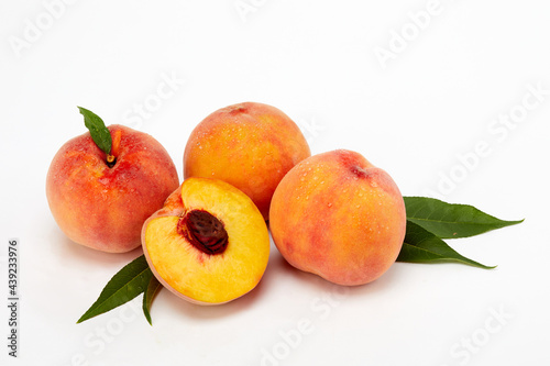 Fresh peaches and leaves