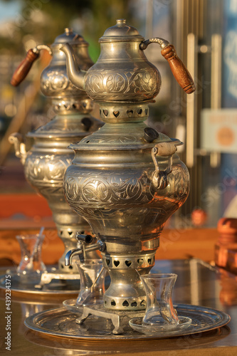 Turkish samovar tea pot at the table in outdoor cafe in Turkey