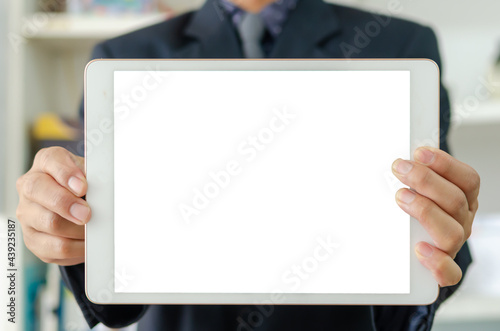 Businessman holding a blank white touch screen tablet. Used to put text or information to advertise news or sell products online. concept marketing business