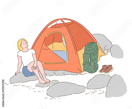 A woman is camping in a tent in the valley. hand drawn style vector design illustrations. 