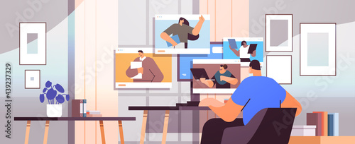 businessman discussing with colleagues during video call virtual conference online communication