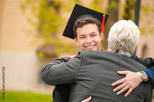 Happy young man with his father on graduation day photo