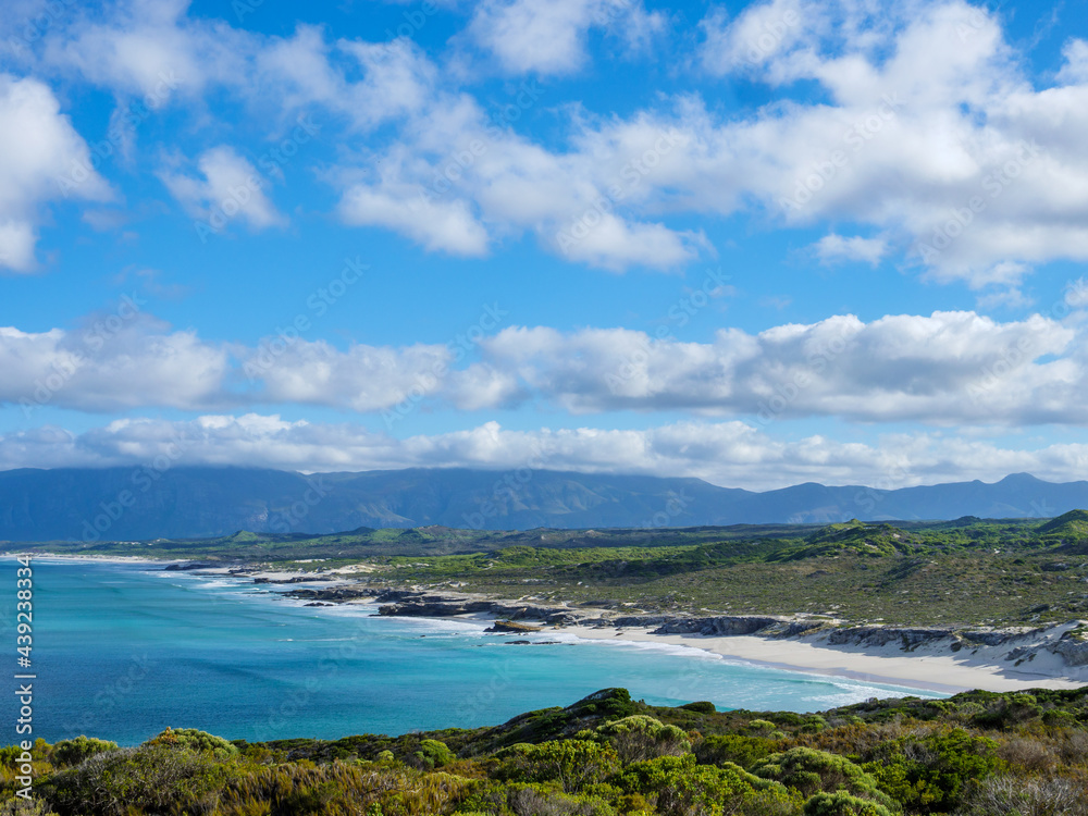 Wonderful elevated views of the Walker Bay Nature Reserve coastline with the Kleinrivier mountains in the far distance. De Kelders near Gansbaai. Overberg. Western Cape. South Africa.