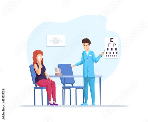 Woman patient in doctor office checks her eyesight on vision test chart. Girl visited physician for regular medical checking. Clinical analysis, treatment and diagnostic tests