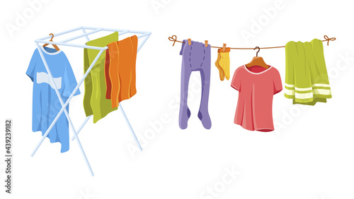 Adult and baby clothes hanging on clothesline. Drying clothes and towel after washing on rope. Socks, T-shirt, tights, bath and kitchen towels, linen on dryer