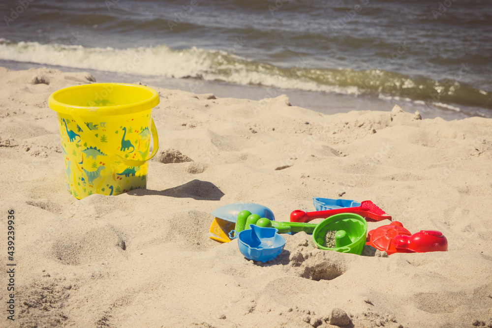 Children toys for relax or playing at beach. Summer, vacation time and child development Children toys for relax or playing at beach. Summer, vacation time and child development