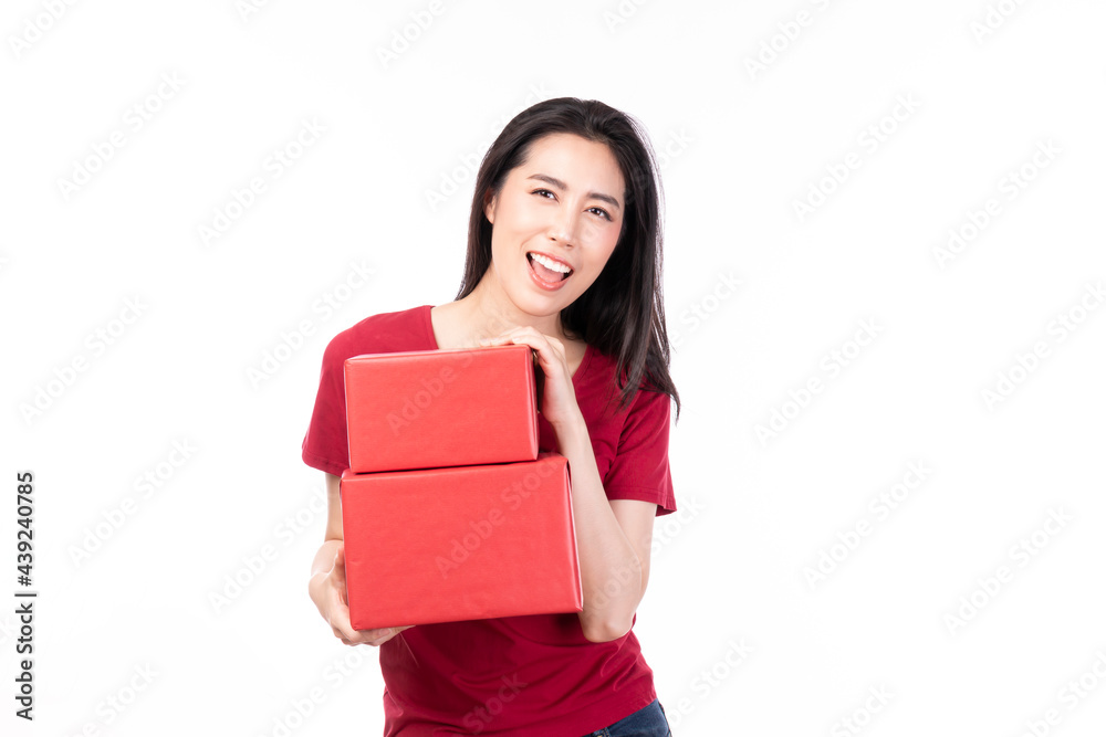 Asian women holding red present box. Portrait of happy smiling Asian girl in casual clothing holding gift box isolated on white. Happy pretty Asian woman holding red gift box on white background.