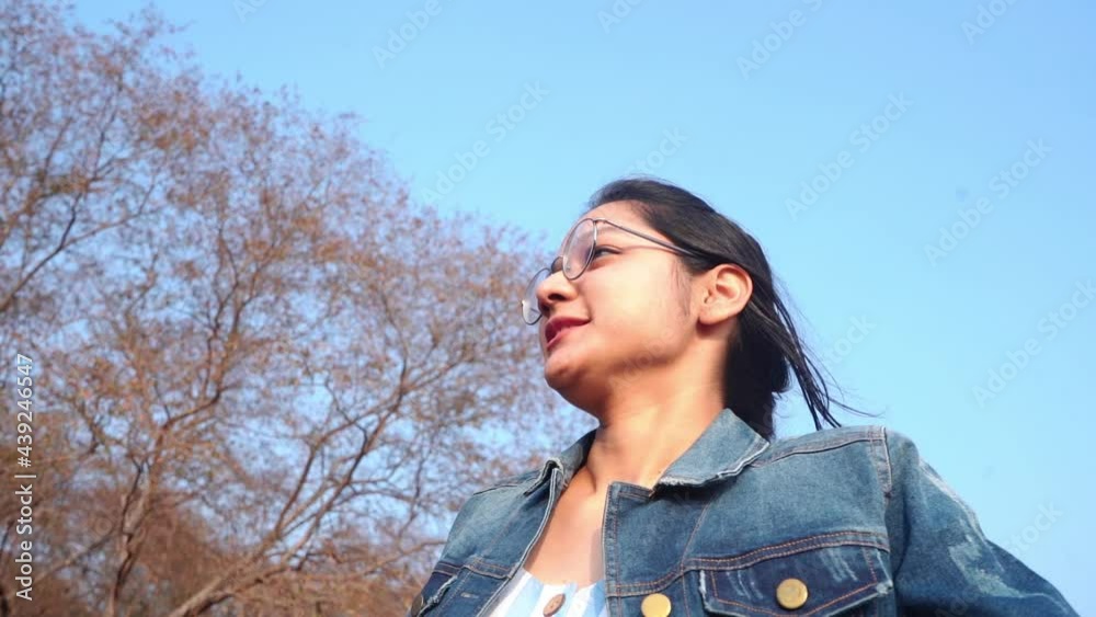 Woman Wearing Eyeglasses Horseback Riding During Daytime Under Blue Sky. - Close Up Shot Woman Wearing Eyeglasses Horseback Riding During Daytime Under Blue Sky. - Close Up Shot