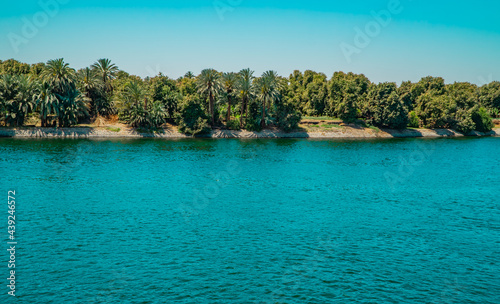 Panoramic view of fertile vegetation along the banks of the Nile River near Edfu, Egypt